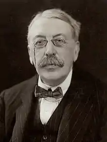 Man in late middle age, wearing pince-nez and a moustache