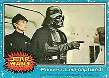 A Star Wars Topps Trading Card from the original 1977 film depicting Darth Vader confronting Princess Leia Organa