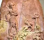 Victory Stele of Naram-Sin, c. 2230 BC. It shows him defeating the Lullibi, a tribe in the Zagros Mountains, and their king Satuni, trampling them and spearing them. Satuni, standing right, is imploring Naram-Sin to save him. Naram-Sin is also twice the size of his soldiers.