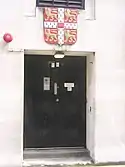 The university's arms above the back door to Bentley House, formerly the University Press's London office