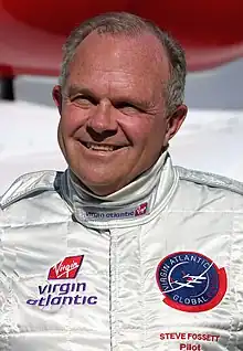 man in flight suit with Virgin Atlantic emblems