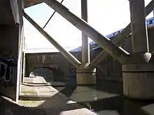 The aqueduct behind struts of motorway looking towards Birmingham