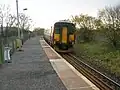 Stewarton station in 2008 with a train heading to Kilmarnock