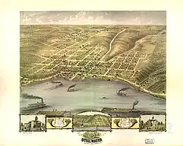 A panoramic, aerial sketch of Stillwater. Steamboats enter and leave the city on the St. Croix River. The town, surrounded by timberland and hills, has a Main Street which runs along the of the St. Croix, and a locomotive runs parallel to it. A courthouse, built on land donated by Nelson, is located to the left (south) in a more sparsely populated part of the town.