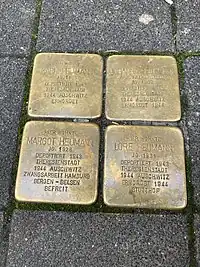 Stolpersteine for Margot Heumann and her family. Each has the name of a family member with details of their lives and experiences during the Holocaust.