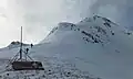 Skiers climbing the north ridge of Storm Peak