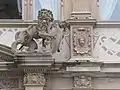 Lion of central portal and reliefs of façade