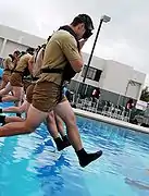 Entering the water during the pool phase of the Special Forces Underwater Operations School at Naval Air Station Key West.