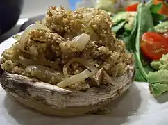 A stuffed mushroom with spiced quinoa