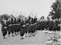 The burial service for the Australian sailors killed during the raid on Sydney.