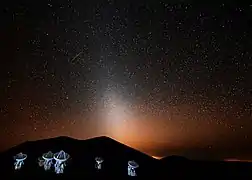 The Submillimeter Array at night in 2015, lit by flash