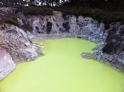 Water pond made yellow by sulfur