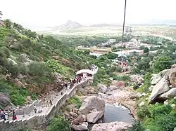 Photo shows Sundha Mata temple's ropeway, navigating stairs between mountains.