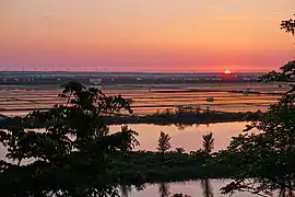 A sunset view of Hachirōgata, from Mikurabana Park