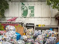 Bags of cans by the Sure We Can logo