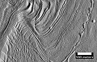 Surface of Nilosyrtis Mensae showing ridges and cracks, as seen by HiRISE, under the HiWish program.