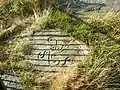 The Victorian-era reproduction of the Swastika Stone on Ilkley Moor, which sits near the original to aid visitors in interpreting the carving