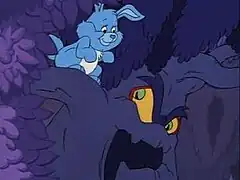 A blue rabbit stands upon one of the branches of a possessed tree, looking at its menacing face.