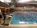 The swimming portion of an indoor triathlon.