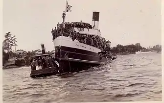 With a capacity spectator crowd, 1920s or early 1930s