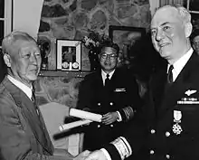 Rhee awarding a medal to US Navy Rear Admiral Ralph A. Ofstie during the Korean War in 1952