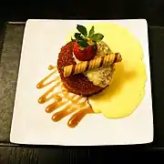 A syrup sponge pudding dessert with a biscuit roll from England