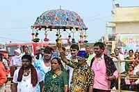 People participating in the fair with the famous umbrella of Tarnetar