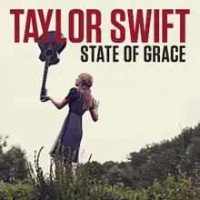 Cover art for "State of Grace": Swift in a grassland with her back towards the camera, holding a guitar upside-down