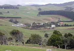 Te Mata in 2010, viewed from the west, with Pirongia in the background. The 1905 hall is towards the left.