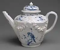 Teapot with relief and painted decoration