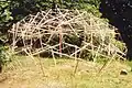 A tensegrity dome made of garden stakes and nylon twine built in the yard of a house, 2009