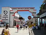 Tourists entering Playa del Carmen's ferry terminal