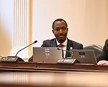 Jazz Lewis sits in front of a laptop during a House Appropriations Committee hearing