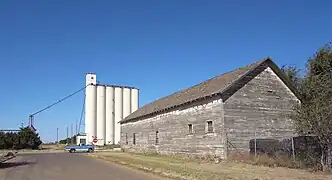 Grain elevator in New Mexico, wooden building in Texas