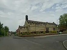 Church of St Michael and All Angels and adjoining Stone Wall to West Side of Churchyard