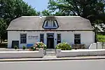 The Cottage is a worthy T -shaped old Cape house, probably built in 1832.

Across the main road from the Auld House in Swellendam there is a very interesting historical group – a small square, a row of tuishuise or farmers' town houses and The Cottage. Th. "The Cottage" is a worthy T-shaped old Cape house, probably built in 1832.