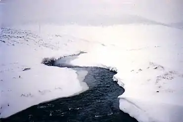 A snowbound Eucumbene River, upstream from Lake Eucumbene, at Kiandra.