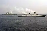 INS Kolkata and HMS Defender during an exercise.