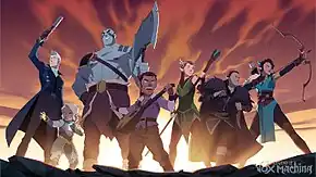 A promotional image from the animated series, with the series' logo as a watermark in the lower right corner. Seven characters are standing on a rocky surface beneath a mostly cloudy sky; they are members of Vox Machina. Each is in an heroic stance and seem ready to fight unseen opponents. The sun is shining low on the horizon, illuminating them from behind and casuing the clouds to glow red, orange and purple—as though at sunrise or sunset.