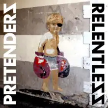 A painting of a child wearing an eyepatch and oversized boxing gloves against grey and white stripes, with the band's name on the left and album title on the right