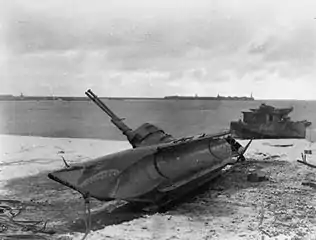 A captured German Biber midget submarine with a shark-mouth design