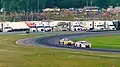 GT3 cars battle through "The Left Hander", turn 3, headed up towards Paul Newman Straight during an IMSA event at Lime Rock Park