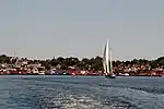 Churches and brightly colored houses near the water.