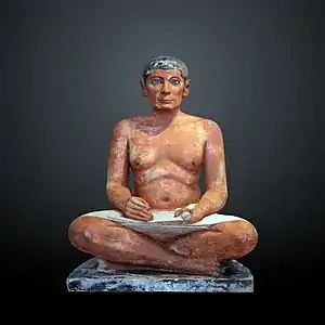 The Seated Scribe; 2613–2494 BC; painted limestone and inlaid quartz; height: 53.7 cm; Louvre