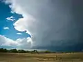 A thundercloud rolling in over the prairie.