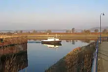 A water-filled dock with stone walls