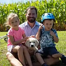 Tim van de Molen with his daughter, son and new puppy