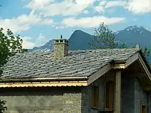 Image 19Alpine chalet being built in Haute-Maurienne (Savoy), the use of thick pieces of orthogneiss (4–7 cm) is by the strict architectural regulations in the region bordering the national parks of Vanoise-Grand Paradis. (from Alps)