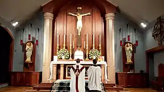 The priest says the Leonine prayers kneeling on the steps to the altar.