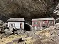 Helleren farm with two traditional houses from the 1800s built under the rock shelter